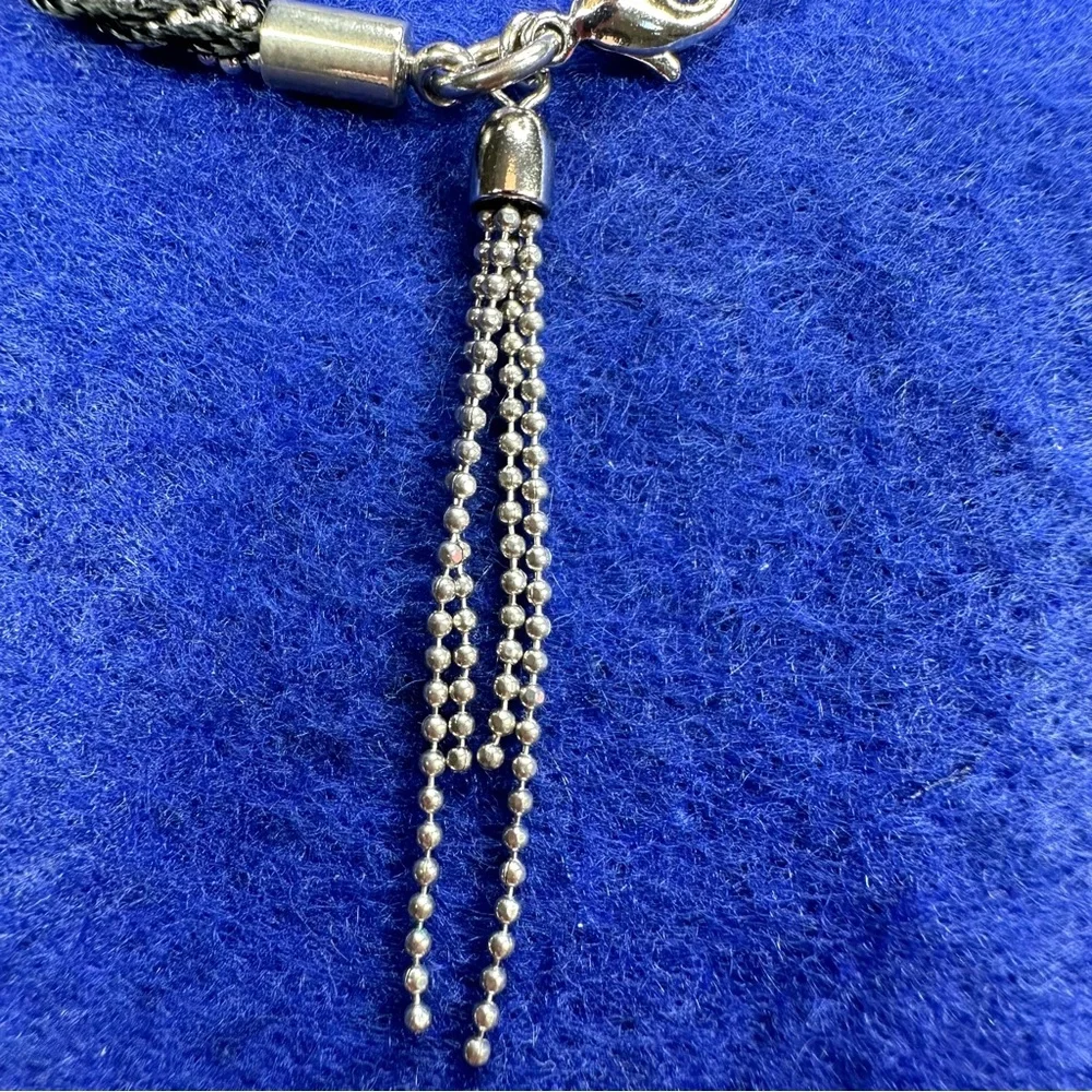 Boho Braided Silver tone and black bracelet with tassel.